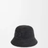 Bucket-Hut aus Raffia und Kalbsleder Bucket-Hut aus Raffia und Kalbsleder