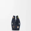 «Cats» mittlere Flamenco-Clutch aus besticktem Denim «Cats» mittlere Flamenco-Clutch aus besticktem Denim