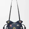 «Cats» mittlere Flamenco-Clutch aus besticktem Denim «Cats» mittlere Flamenco-Clutch aus besticktem Denim