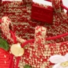 Erdbeer-Beutel mit Kordelzug aus klassischem Kalbsleder und Raffia Erdbeer-Beutel mit Kordelzug aus klassischem Kalbsleder und Raffia