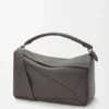 Grosse Puzzle-Tasche aus geschmeidigem genarbtem Kalbsleder Grosse Puzzle-Tasche aus geschmeidigem genarbtem Kalbsleder