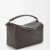 Grosse Puzzle-Tasche aus geschmeidigem genarbtem Kalbsleder Grosse Puzzle-Tasche aus geschmeidigem genarbtem Kalbsleder