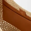 Kleine Hobo-Tasche mit Lochmuster aus Raffia und Kalbsleder Kleine Hobo-Tasche mit Lochmuster aus Raffia und Kalbsleder