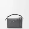 Kleine Puzzle Edge-Tasche aus klassischem Kalbsleder Kleine Puzzle Edge-Tasche aus klassischem Kalbsleder