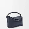 Kleine Puzzle Edge-Tasche aus weichem, genarbtem Kalbsleder Kleine Puzzle Edge-Tasche aus weichem, genarbtem Kalbsleder