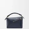 Kleine Puzzle Edge-Tasche aus weichem, genarbtem Kalbsleder Kleine Puzzle Edge-Tasche aus weichem, genarbtem Kalbsleder