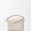Kleine Puzzle Edge-Tasche aus weichem, genarbtem Kalbsleder Kleine Puzzle Edge-Tasche aus weichem, genarbtem Kalbsleder