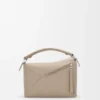Kleine Puzzle Edge-Tasche aus weichem, genarbtem Kalbsleder Kleine Puzzle Edge-Tasche aus weichem, genarbtem Kalbsleder