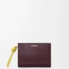 Kompaktes Portemonnaie mit Knot-Motiv aus glänzendem Nappa-Kalbsleder Kompaktes Portemonnaie mit Knot-Motiv aus glänzendem Nappa-Kalbsleder