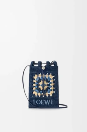 Kordelzugtasche aus klassischem Kalbsleder und Raffia Kordelzugtasche aus klassischem Kalbsleder und Raffia