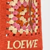 Kordelzugtasche aus klassischem Kalbsleder und Raffia Kordelzugtasche aus klassischem Kalbsleder und Raffia