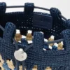 Kordelzugtasche aus klassischem Kalbsleder und Raffia Kordelzugtasche aus klassischem Kalbsleder und Raffia