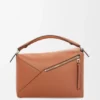 Mittlere «Puzzle Edge»-Tasche aus klassischem Kalbsleder Mittlere «Puzzle Edge»-Tasche aus klassischem Kalbsleder