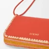 Rio-Pouch aus klassischem Kalbsleder und Raffia Rio-Pouch aus klassischem Kalbsleder und Raffia