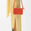 Rio-Pouch aus klassischem Kalbsleder und Raffia Rio-Pouch aus klassischem Kalbsleder und Raffia
