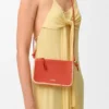 Rio-Pouch aus klassischem Kalbsleder und Raffia Rio-Pouch aus klassischem Kalbsleder und Raffia