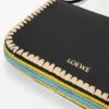 Rio-Pouch aus klassischem Kalbsleder und Raffia Rio-Pouch aus klassischem Kalbsleder und Raffia